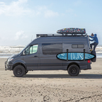Van with Magnetic Surfboard Rack for beach camping